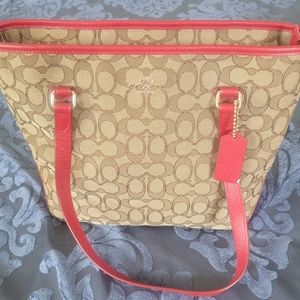 Red and tan Coach handbag